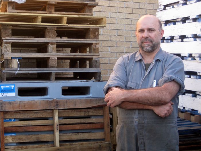 Small business owner and pallets © Planet Ark